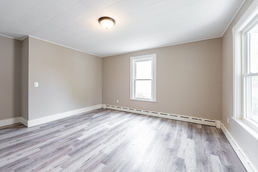 37 North Street Three Rivers, MA 01080 - Photo 16 of 35 an empty room with wooden floor and windows