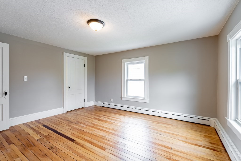 37 North Street Three Rivers, MA 01080 - Photo 18 of 35 a view of empty room with wooden floor and fan
