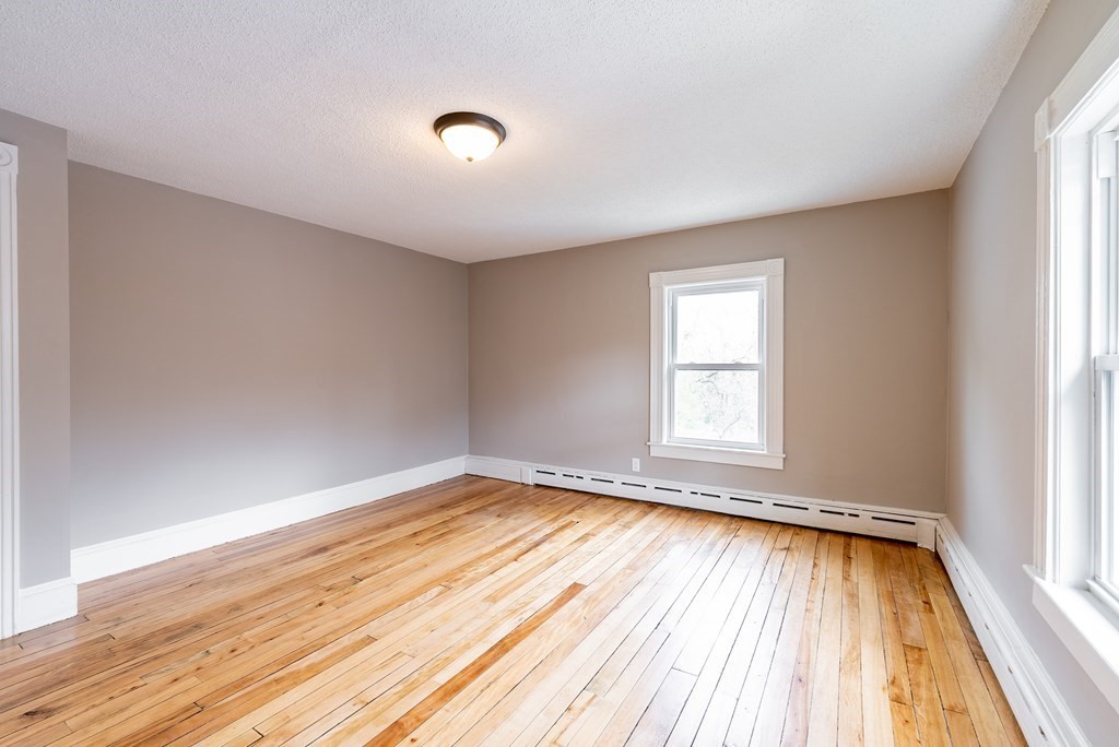 37 North Street Three Rivers, MA 01080 - Photo 20 of 35 an empty room with wooden floor and windows