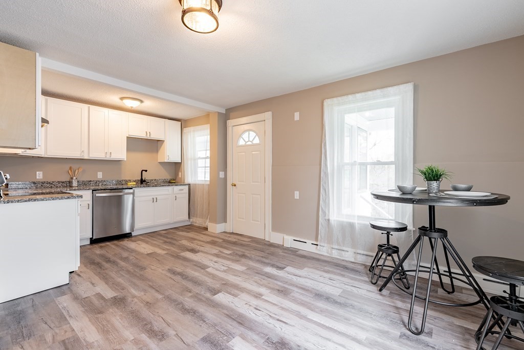 37 North Street Three Rivers, MA 01080 - Photo 2 of 35 a kitchen with a table cabinets a sink stainless steel appliances and cabinets