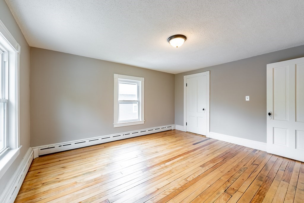 37 North Street Three Rivers, MA 01080 - Photo 22 of 35 a view of an empty room with wooden floor and a window