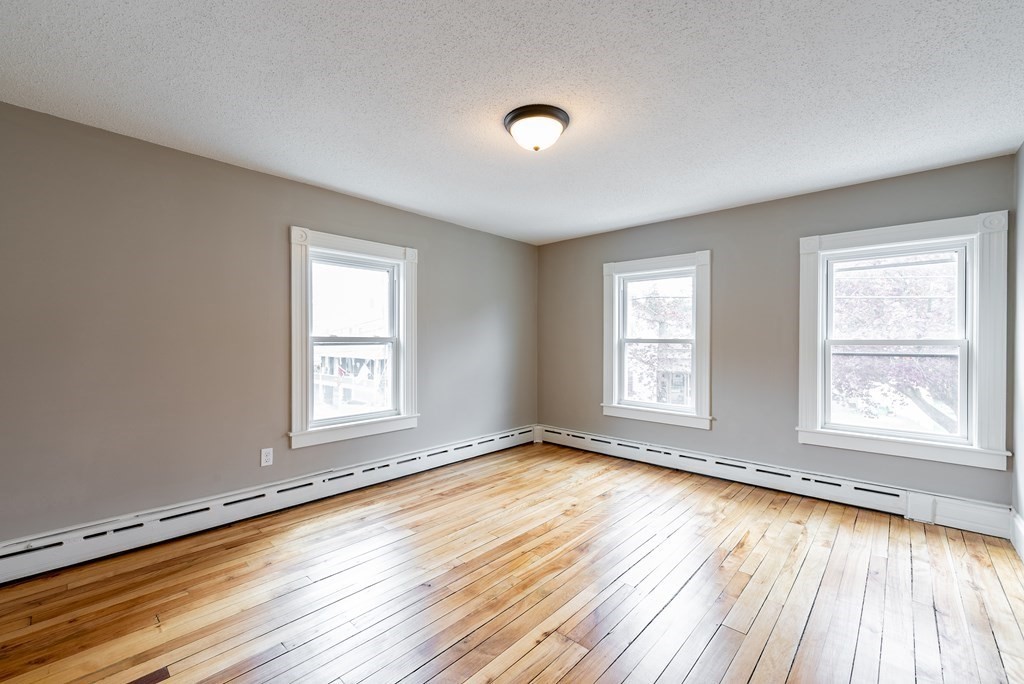 37 North Street Three Rivers, MA 01080 - Photo 23 of 35 a view of an empty room with wooden floor and a window