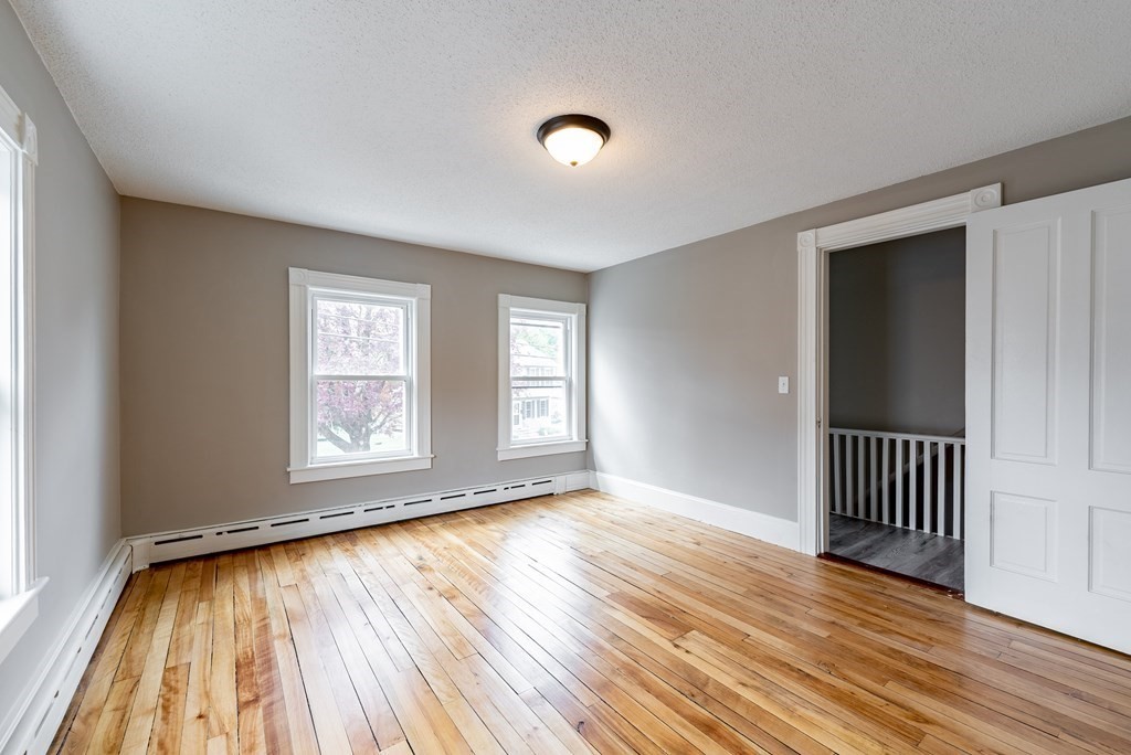 37 North Street Three Rivers, MA 01080 - Photo 24 of 35 an empty room with wooden floor and windows