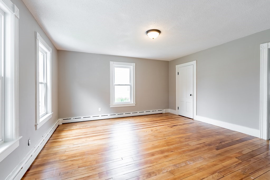 37 North Street Three Rivers, MA 01080 - Photo 27 of 35 a view of an empty room with window and wooden floor