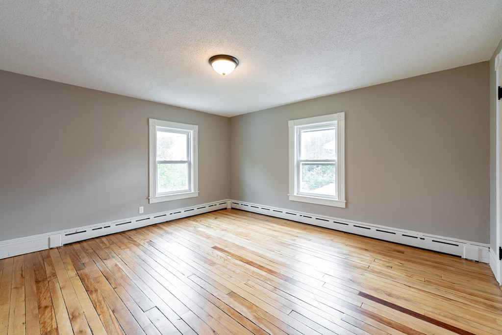 37 North Street Three Rivers, MA 01080 - Photo 28 of 35 a view of an empty room with wooden floor and a window