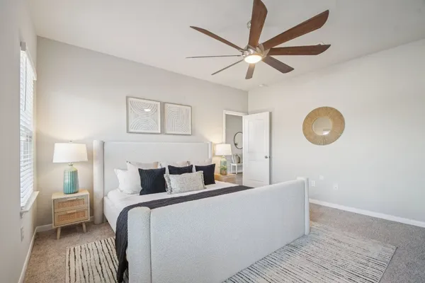 a bed room with a bed and a chandelier