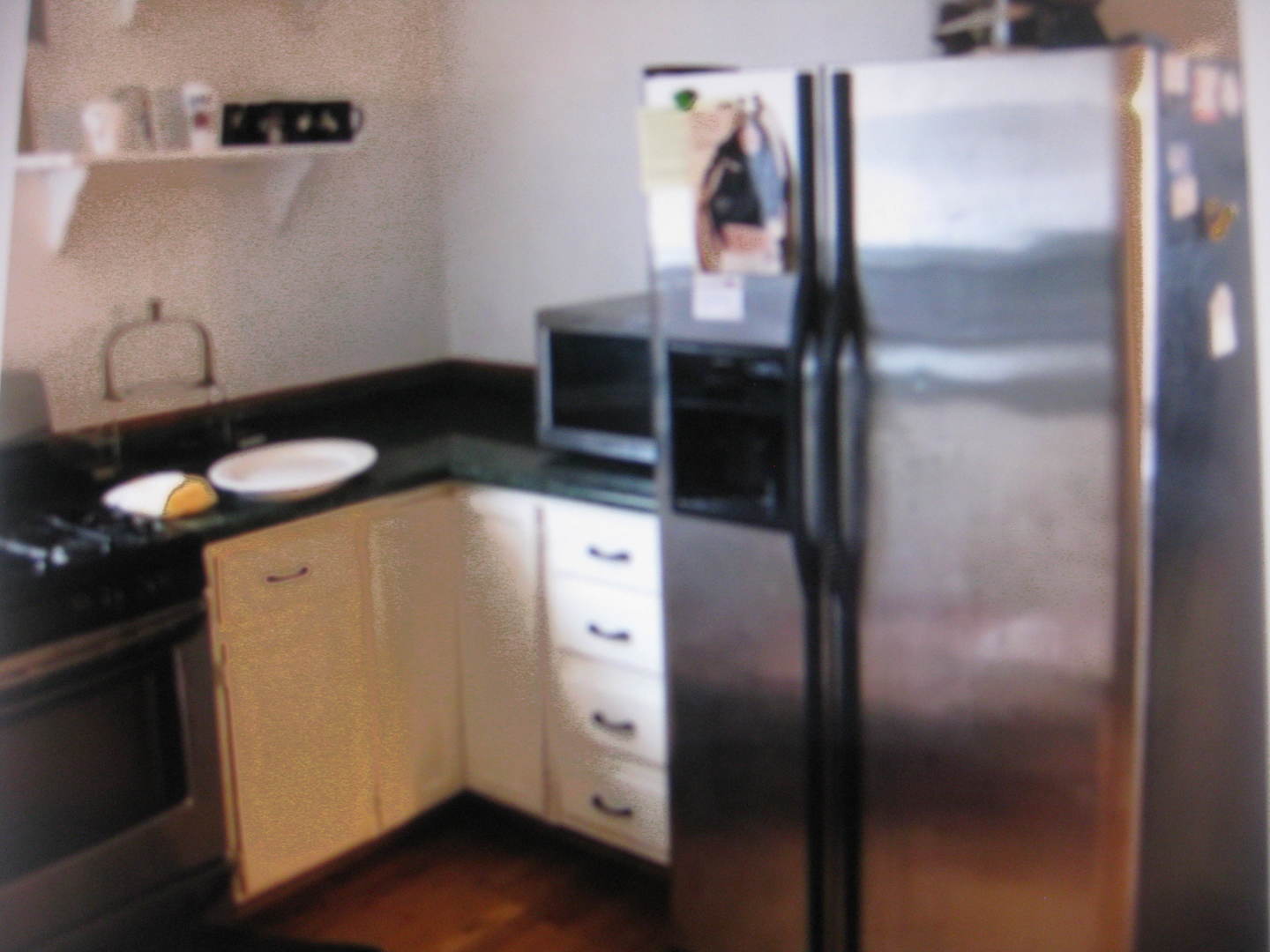 2906 North Pulaski Road Chicago, IL 60641 - Photo 4 of 9 a kitchen with a refrigerator and a stove