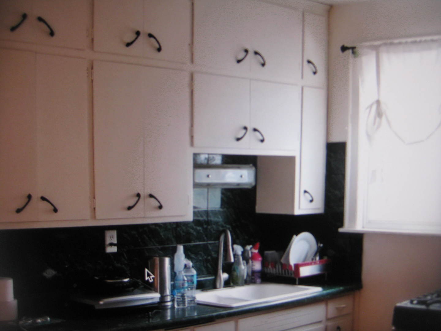 2906 North Pulaski Road Chicago, IL 60641 - Photo 6 of 9 a room with wooden floor and cabinets