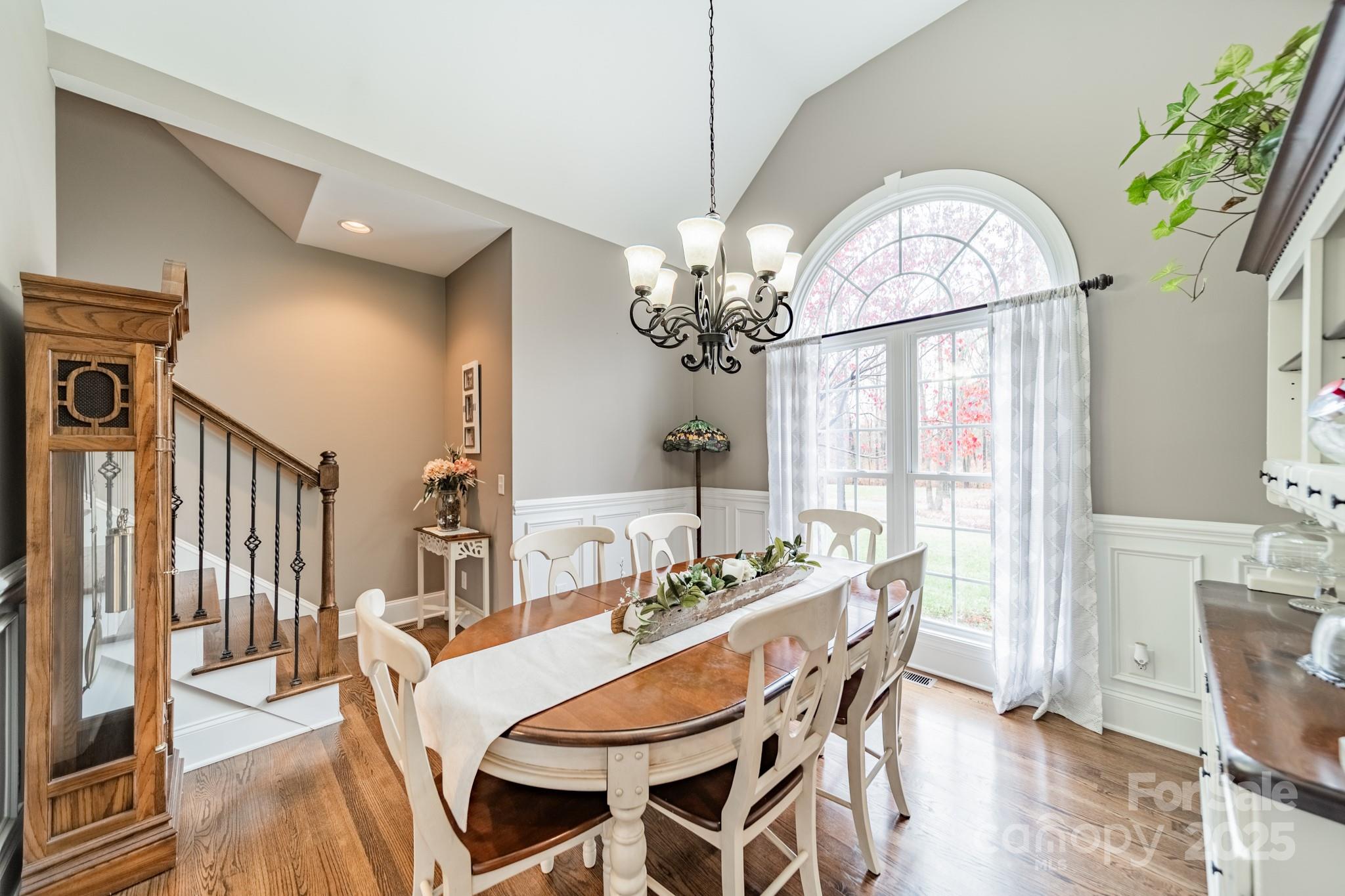 5201 Barrier Store Road Mount Pleasant, NC 28124 - Photo 13 of 46 a view of a dining room with furniture wooden floor and chandelier