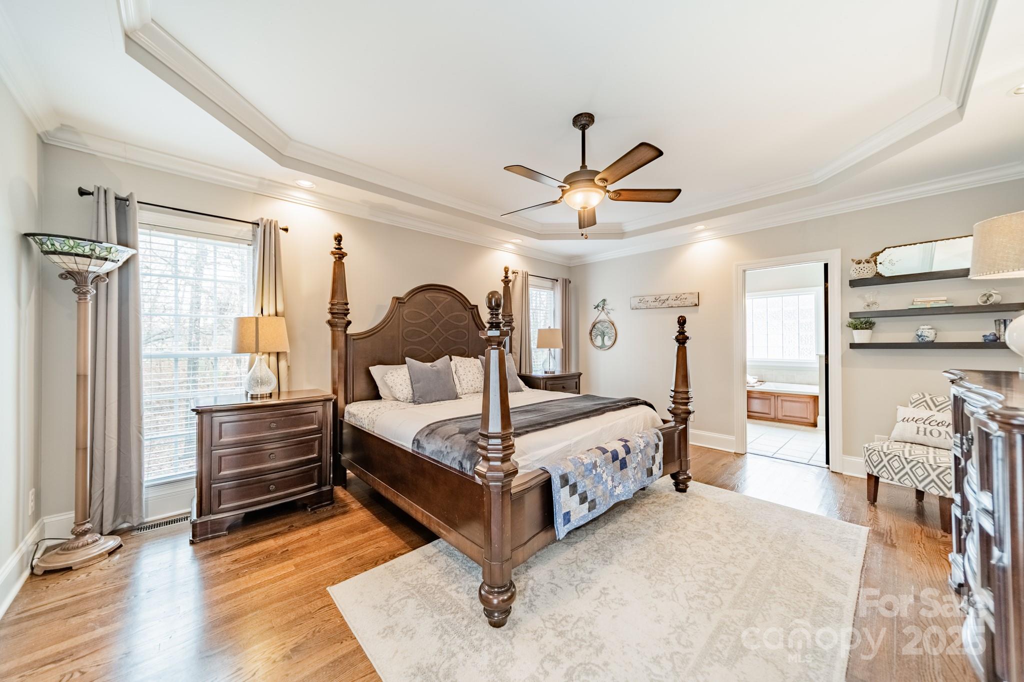 5201 Barrier Store Road Mount Pleasant, NC 28124 - Photo 15 of 46 a bedroom with a bed and a chandelier