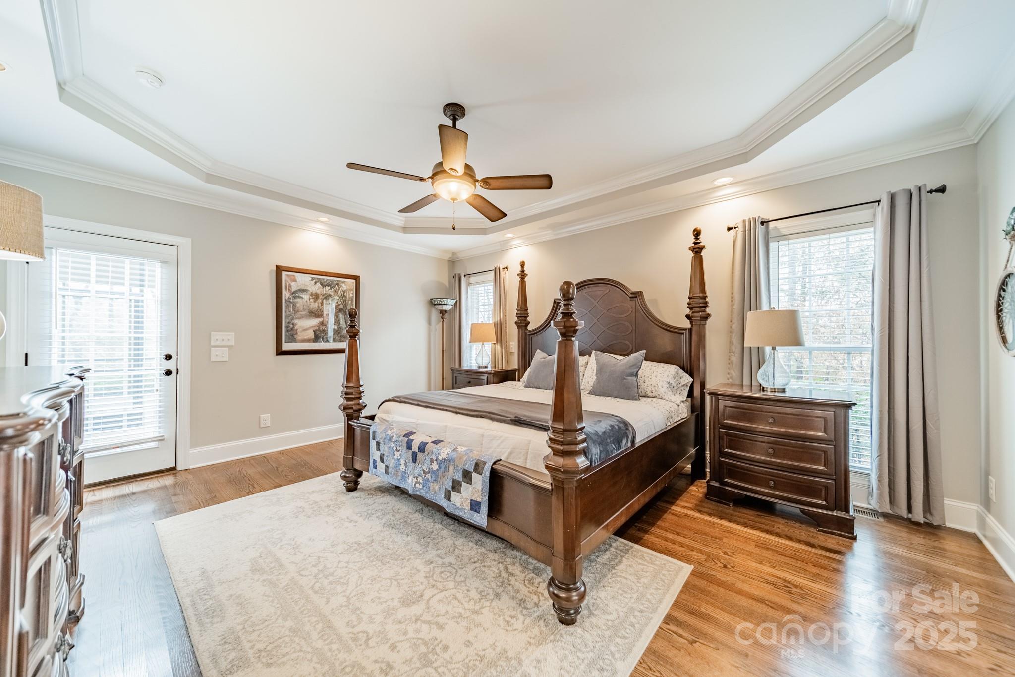 5201 Barrier Store Road Mount Pleasant, NC 28124 - Photo 16 of 46 a bedroom with a bed and a chandelier