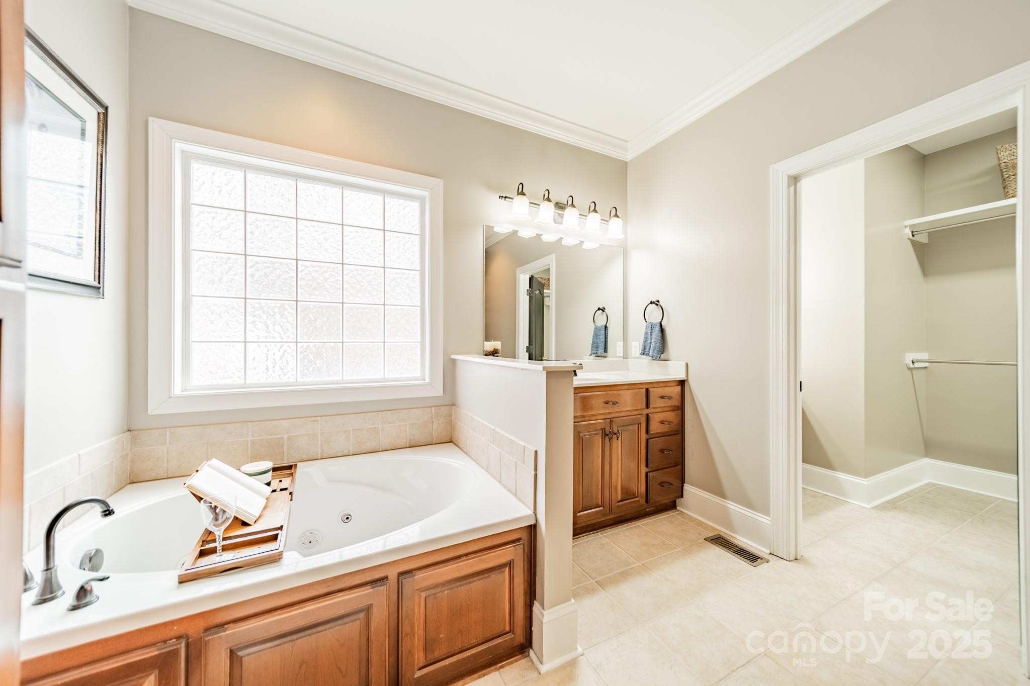 5201 Barrier Store Road Mount Pleasant, NC 28124 - Photo 17 of 46 a bathroom with a tub sink and mirror