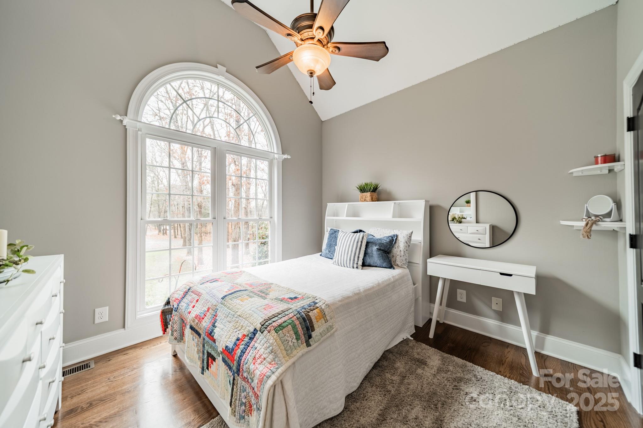 5201 Barrier Store Road Mount Pleasant, NC 28124 - Photo 22 of 46 a bedroom with a bed a chandelier and a window