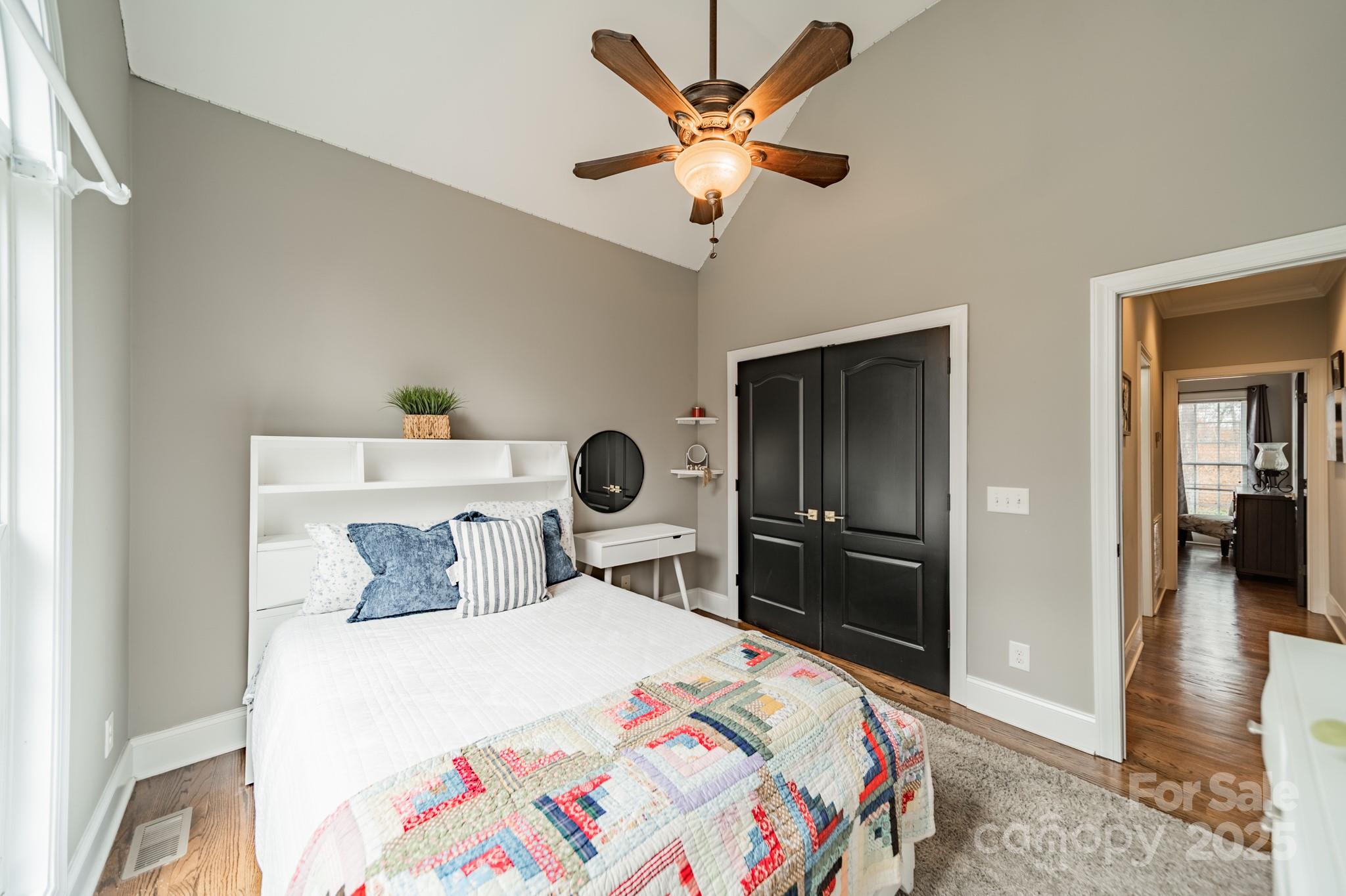 5201 Barrier Store Road Mount Pleasant, NC 28124 - Photo 23 of 46 a bedroom with a bed and a chandelier