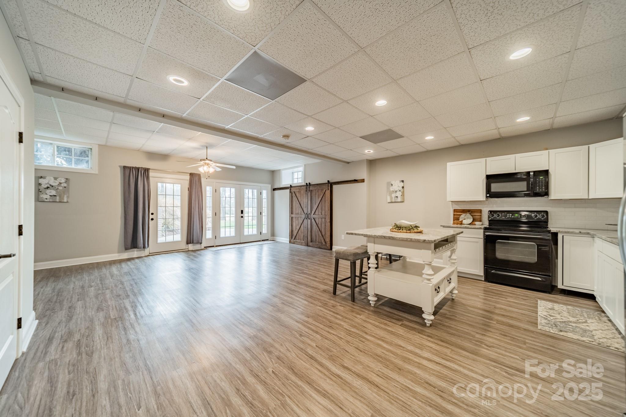 5201 Barrier Store Road Mount Pleasant, NC 28124 - Photo 28 of 46 a living room with furniture and a wooden floor