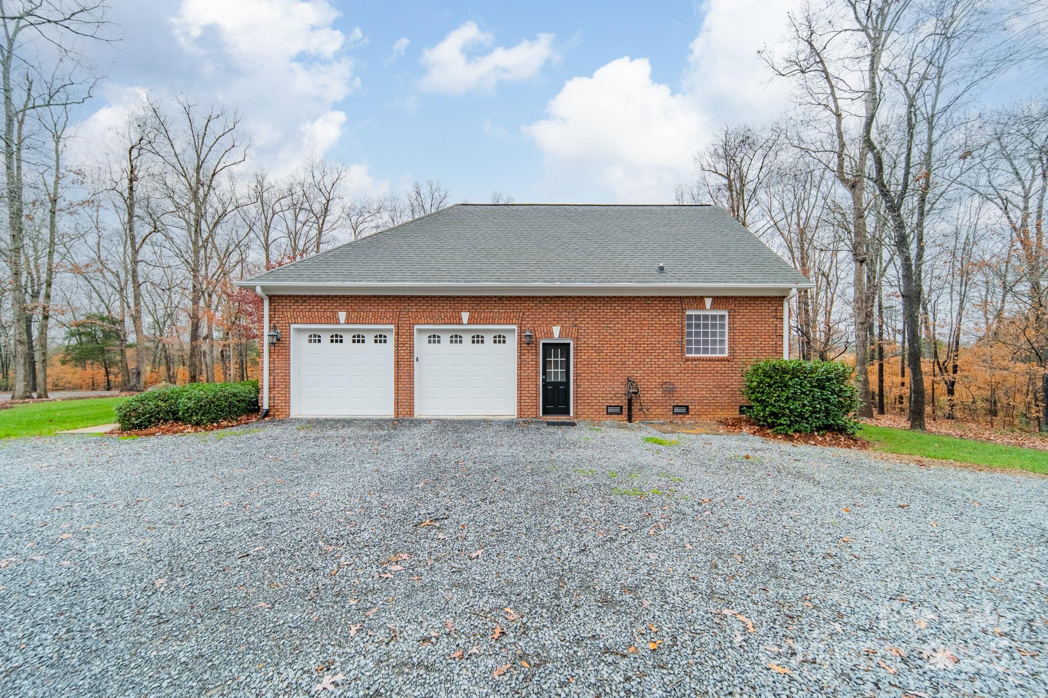5201 Barrier Store Road Mount Pleasant, NC 28124 - Photo 40 of 46 a view of a house with a yard and garage