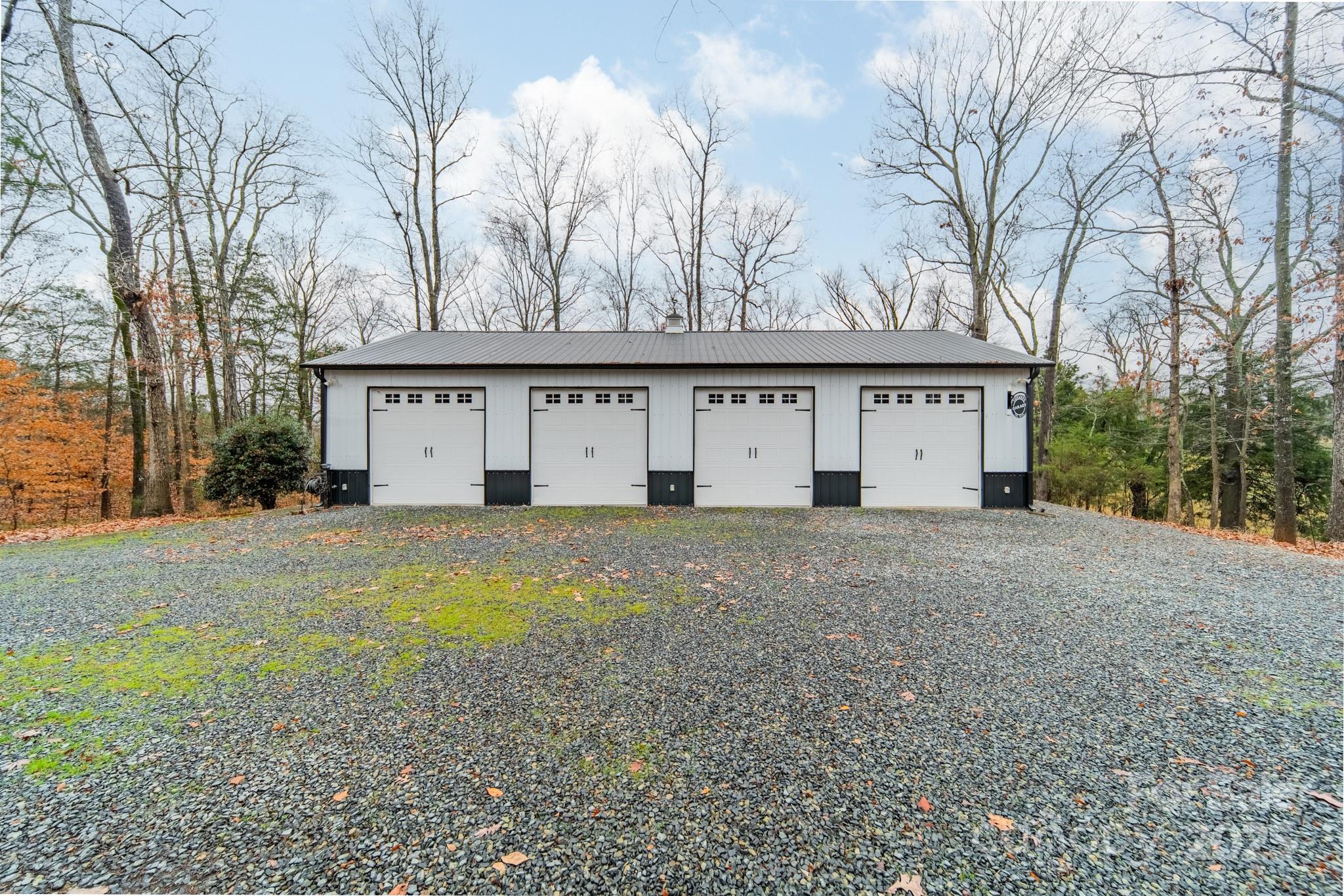 5201 Barrier Store Road Mount Pleasant, NC 28124 - Photo 44 of 46 a view of a large white house with a large tree with wooden fence
