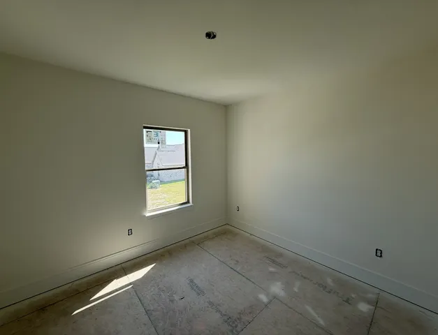 an empty room with window