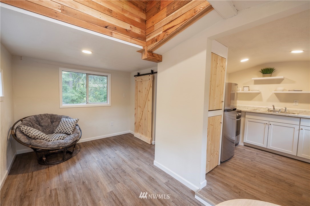26 Webb Road Southwest Lakebay, WA 98349 - Photo 11 of 31 a living room with furniture and a wooden floor
