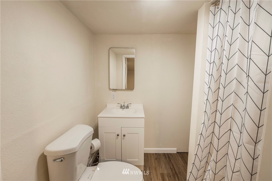 26 Webb Road Southwest Lakebay, WA 98349 - Photo 17 of 31 a bathroom with a toilet sink and mirror