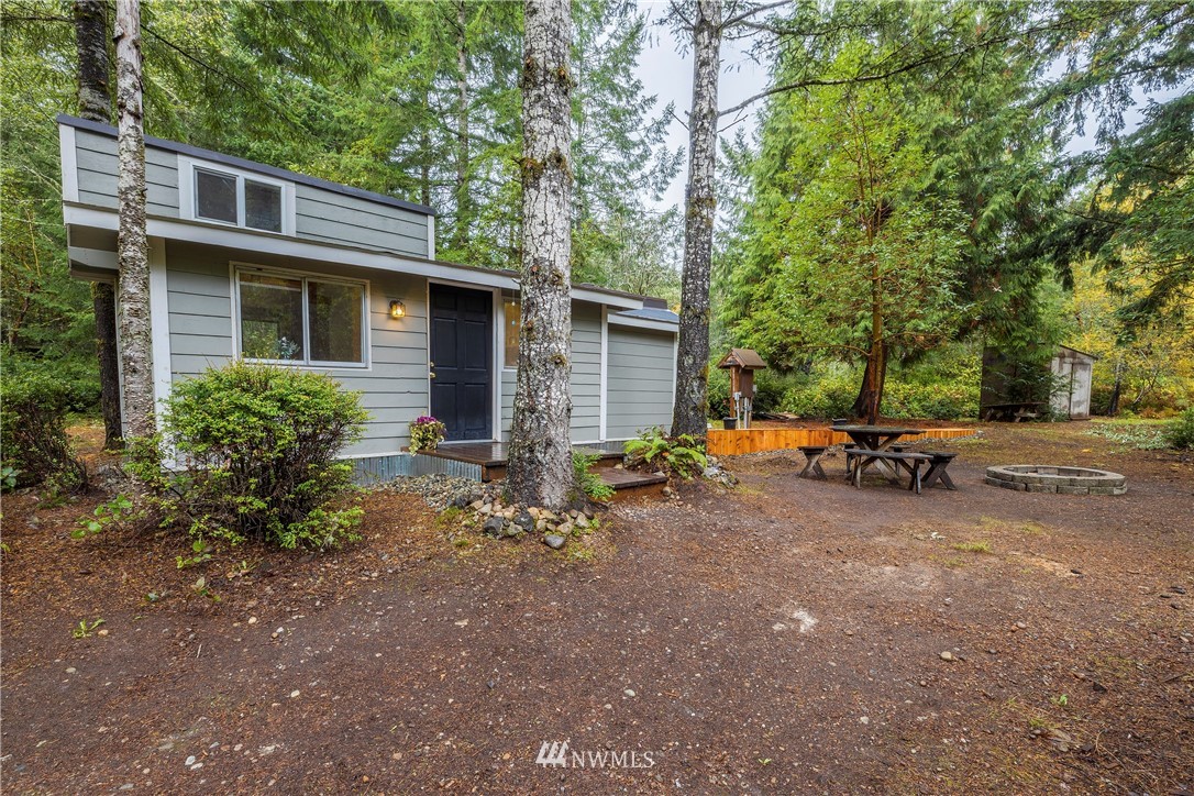 26 Webb Road Southwest Lakebay, WA 98349 - Photo 3 of 31 a view of a patio with table and chairs and potted plants