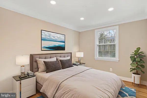 a bedroom with bed and window