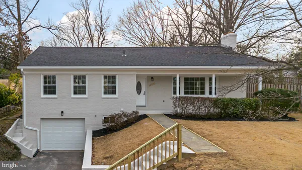 a front view of house with yard outdoor seating and barbeque oven