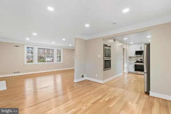 a view of kitchen with cabinets and wooden floor