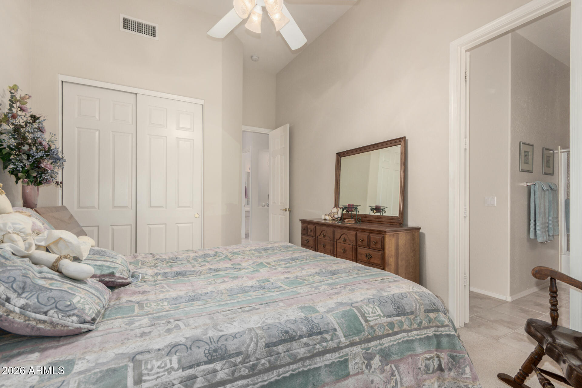 4419 East Robin Lane Phoenix, AZ 85050 - Photo 17 of 28 a bedroom with a bed and a mirror on dresser