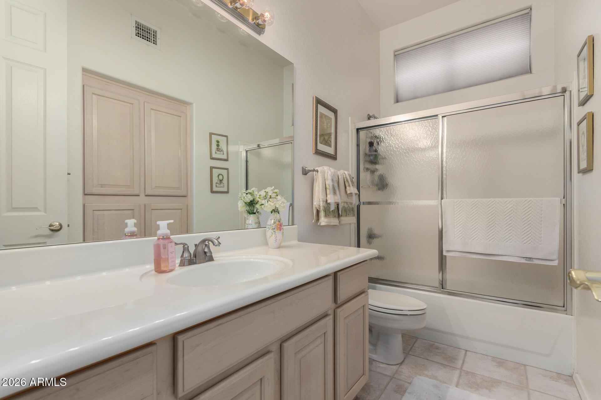 4419 East Robin Lane Phoenix, AZ 85050 - Photo 23 of 28 a bathroom with a sink toilet and shower