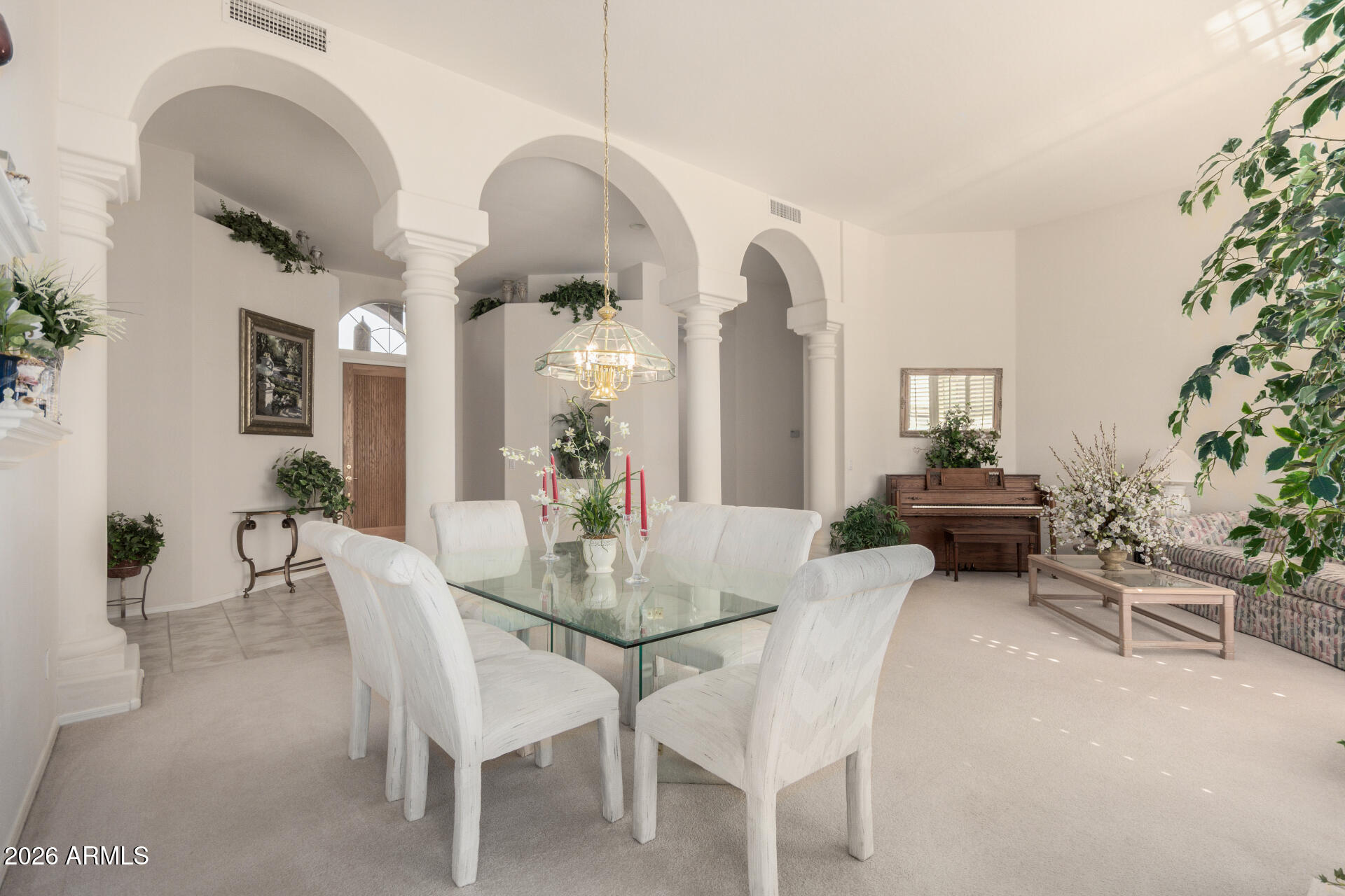 4419 East Robin Lane Phoenix, AZ 85050 - Photo 6 of 28 a view of a dining room with furniture and wooden floor