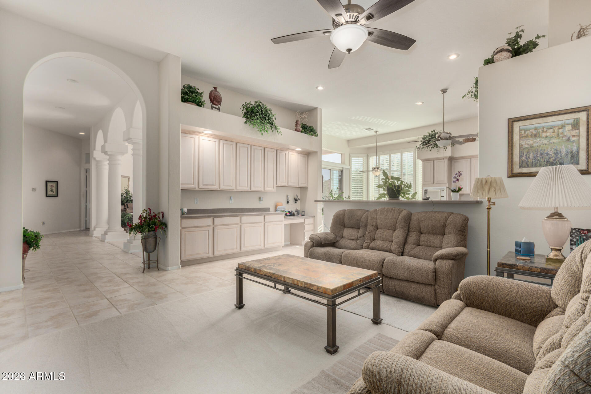4419 East Robin Lane Phoenix, AZ 85050 - Photo 8 of 28 a living room with furniture and a chandelier