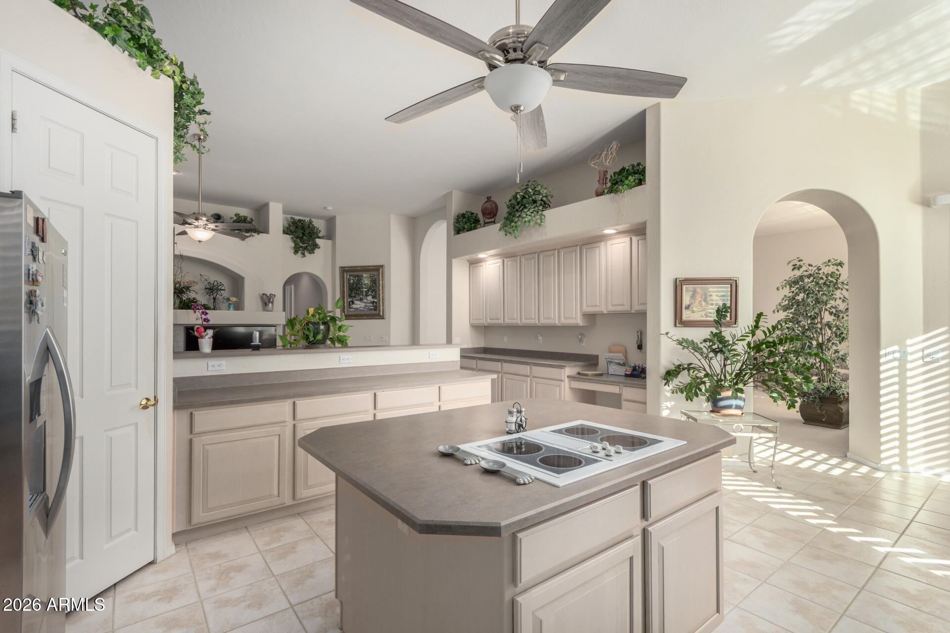 4419 East Robin Lane Phoenix, AZ 85050 - Photo 9 of 28 a kitchen with a sink stove and refrigerator