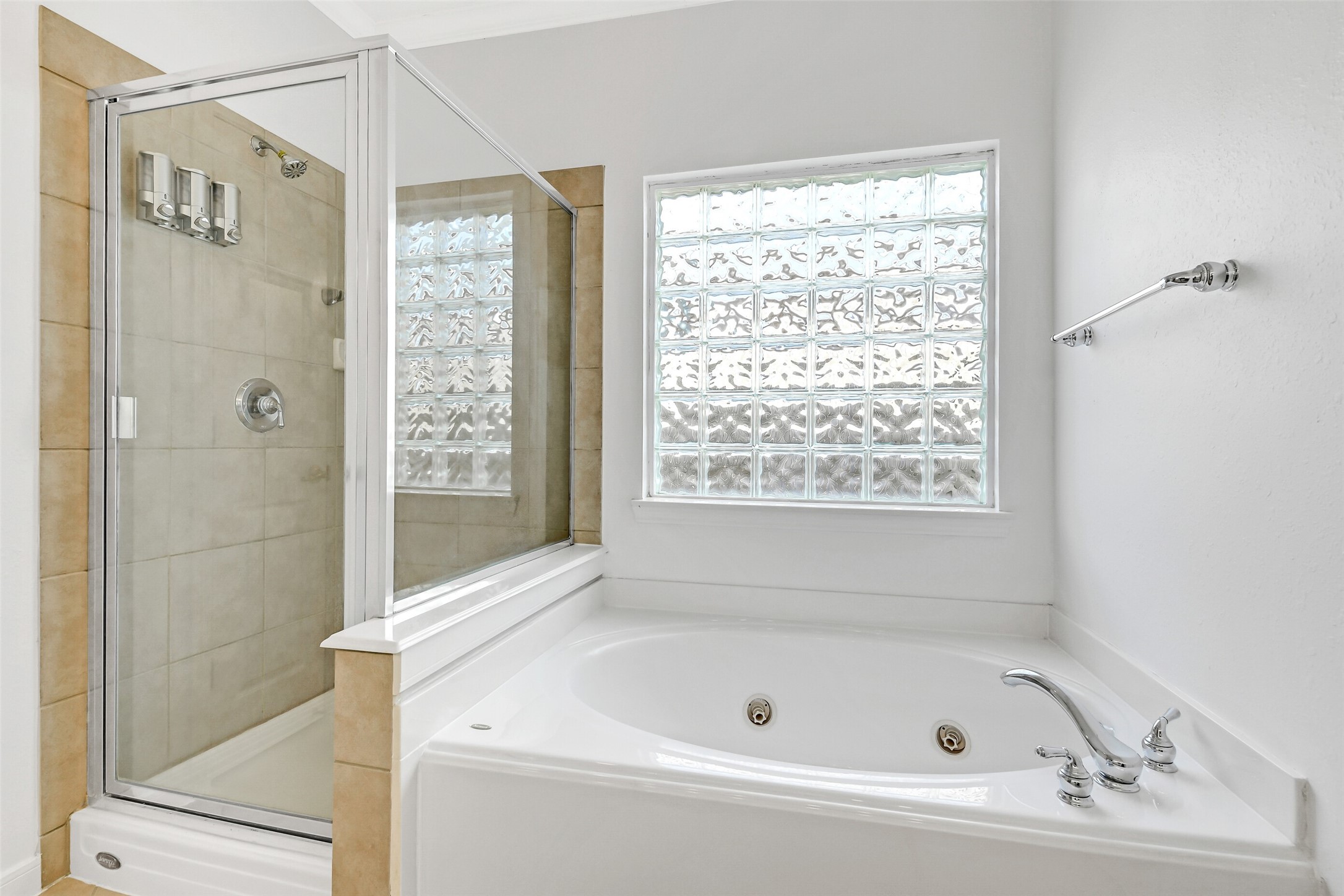 19227 Countryhills Court Spring, TX 77388 - Photo 23 of 33 Luxurious primary bath featuring a jetted tub and a separate shower for ultimate relaxation.