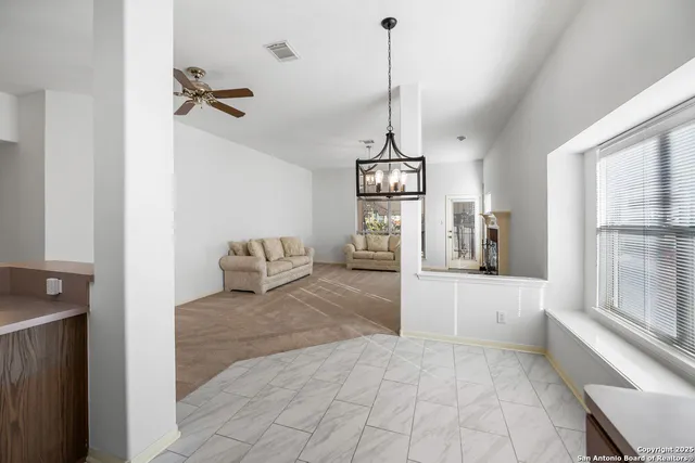 a view of a living room and window