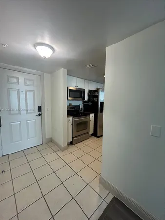 a view of a kitchen with electric appliances