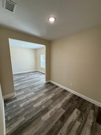 a view of an empty room and window