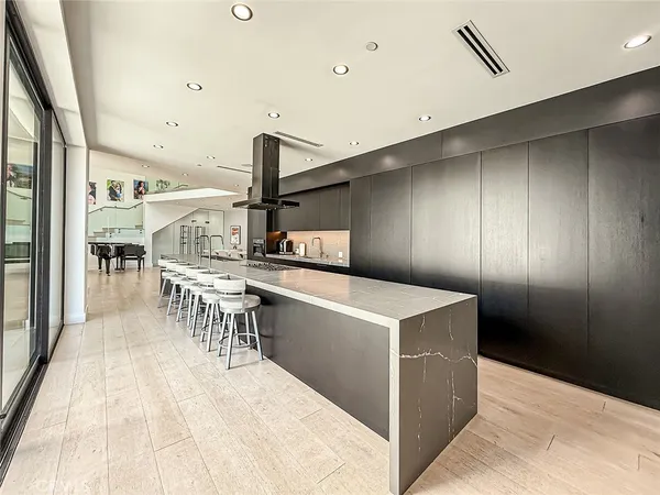 a kitchen with a stove a refrigerator and a table