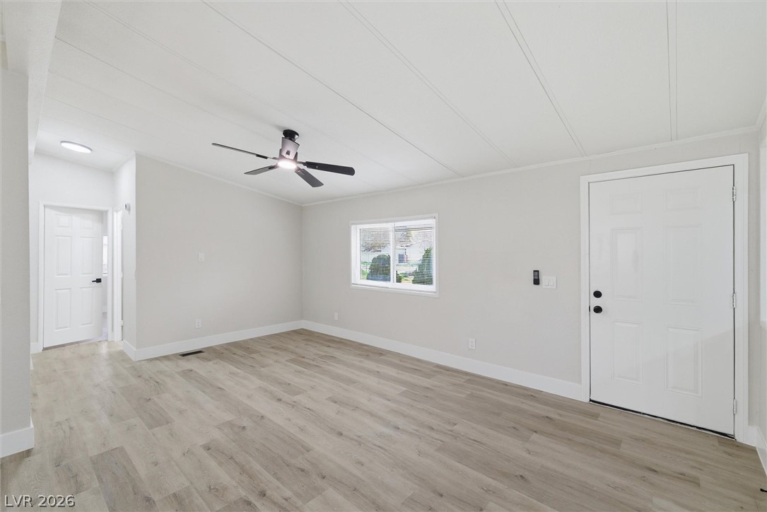 3940 Point Drive Pahrump, NV 89060 - Photo 8 of 35 A welcoming interior with fresh flooring and abundant natural light.