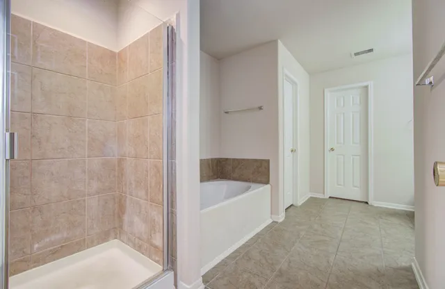 a bathroom with a double vanity sink and mirror