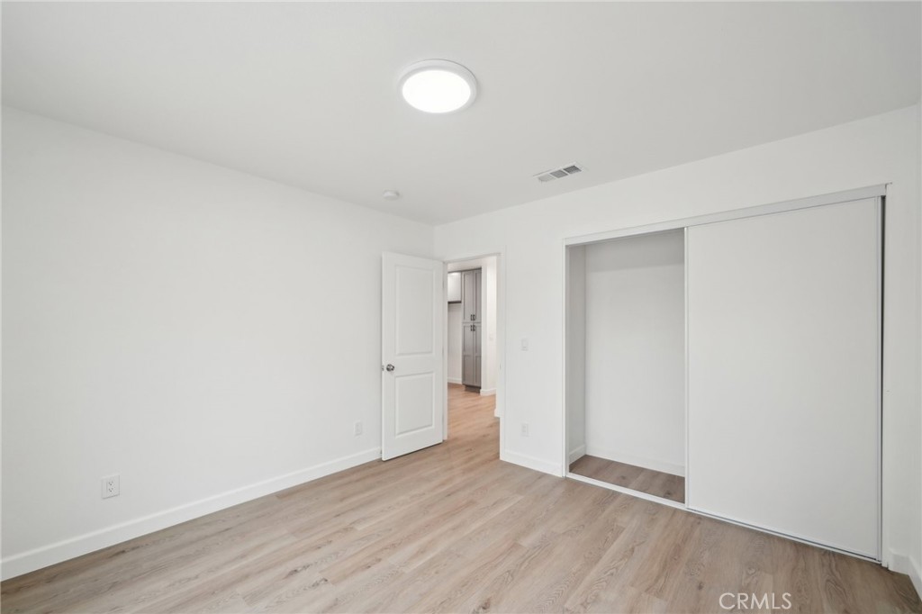 4664 Sierra Street Riverside, CA 92504 - Photo 11 of 30 a view of an empty room with wooden floor