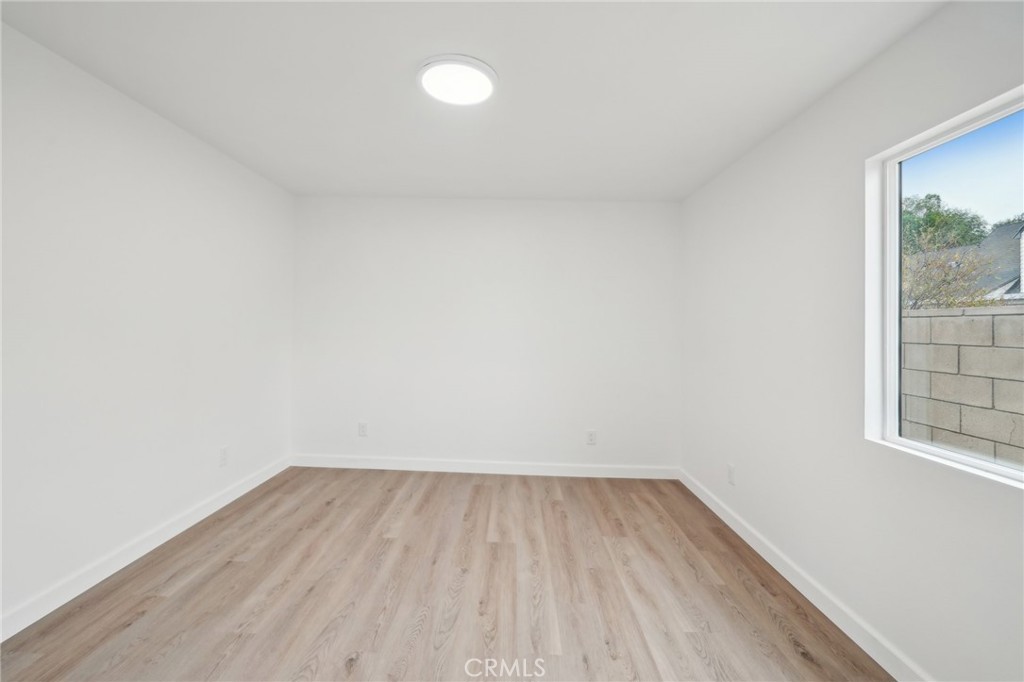 4664 Sierra Street Riverside, CA 92504 - Photo 17 of 30 a view of wooden floor in a room