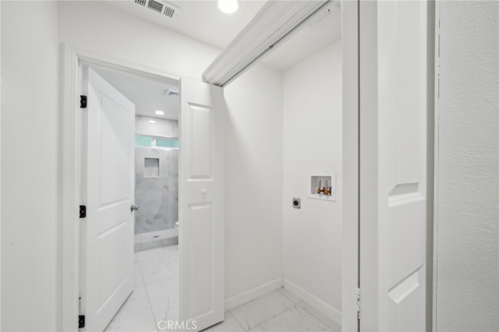 4664 Sierra Street Riverside, CA 92504 - Photo 19 of 30 a bathroom with a shower