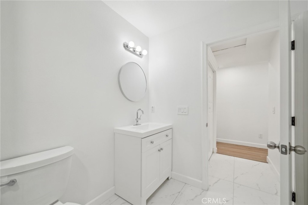 4664 Sierra Street Riverside, CA 92504 - Photo 20 of 30 a bathroom with a sink and mirror