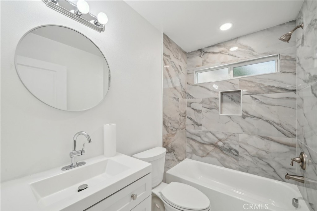 4664 Sierra Street Riverside, CA 92504 - Photo 24 of 30 a bathroom with a sink a toilet and shower