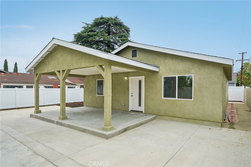 4664 Sierra Street Riverside, CA 92504 - Photo 4 of 30 a view of a house with floor to ceiling windows