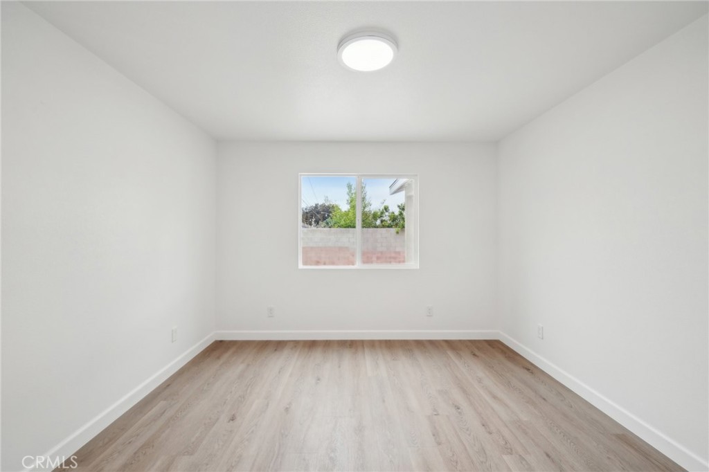 4664 Sierra Street Riverside, CA 92504 - Photo 9 of 30 an empty room with a window