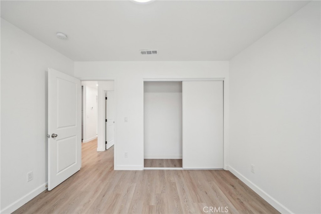 4664 Sierra Street Riverside, CA 92504 - Photo 10 of 30 a view of an empty room with wooden floor