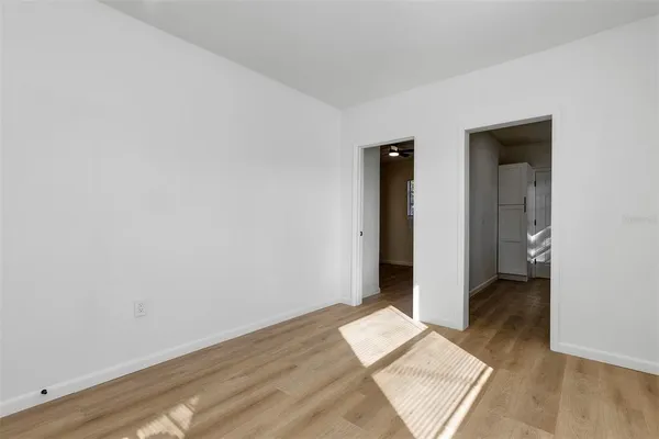 an empty room with wooden floor