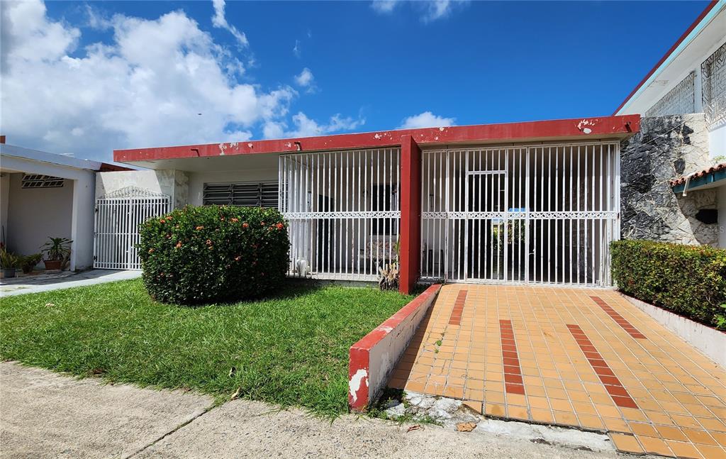 208 Country Club Carolina, PR 00982 - Photo 1 of 1 a view of a house with a yard